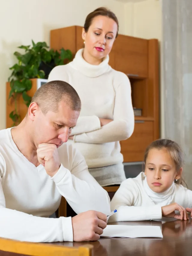 parents filling out child custody paperwork