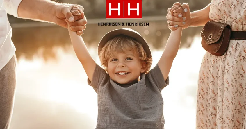 child holding hand with parents