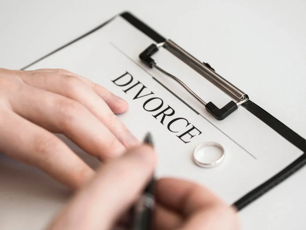 Divorce agreement document with ring