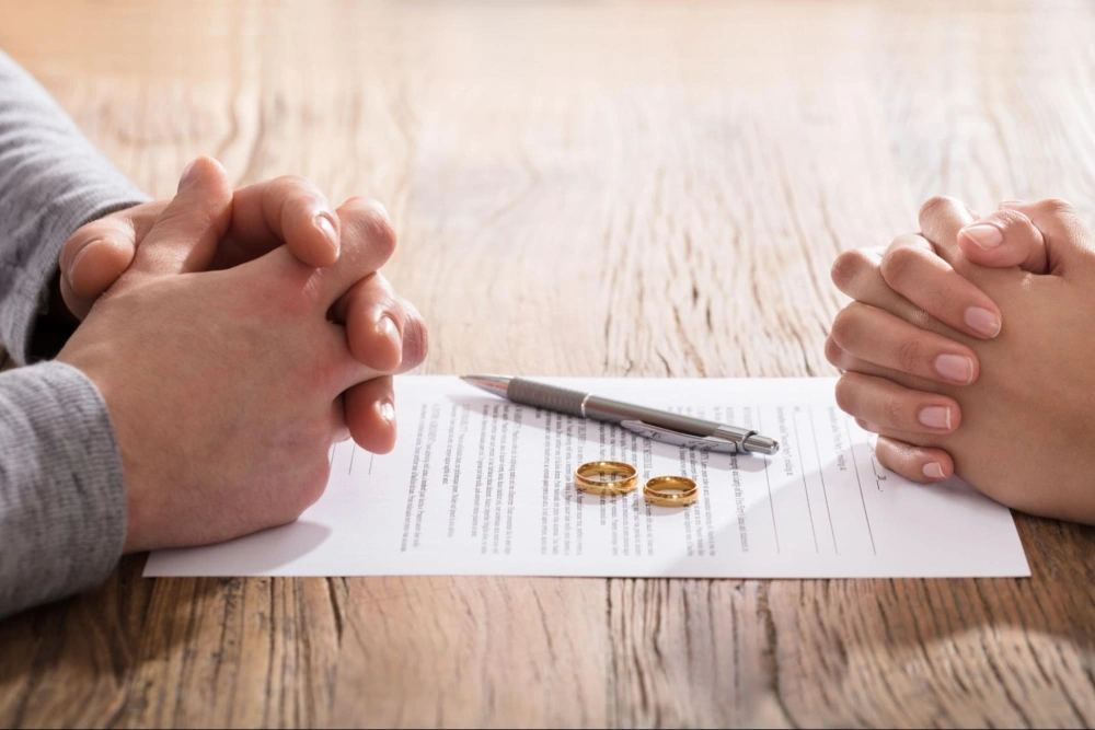 Couple reviewing divorce documents during a financial planning discussion